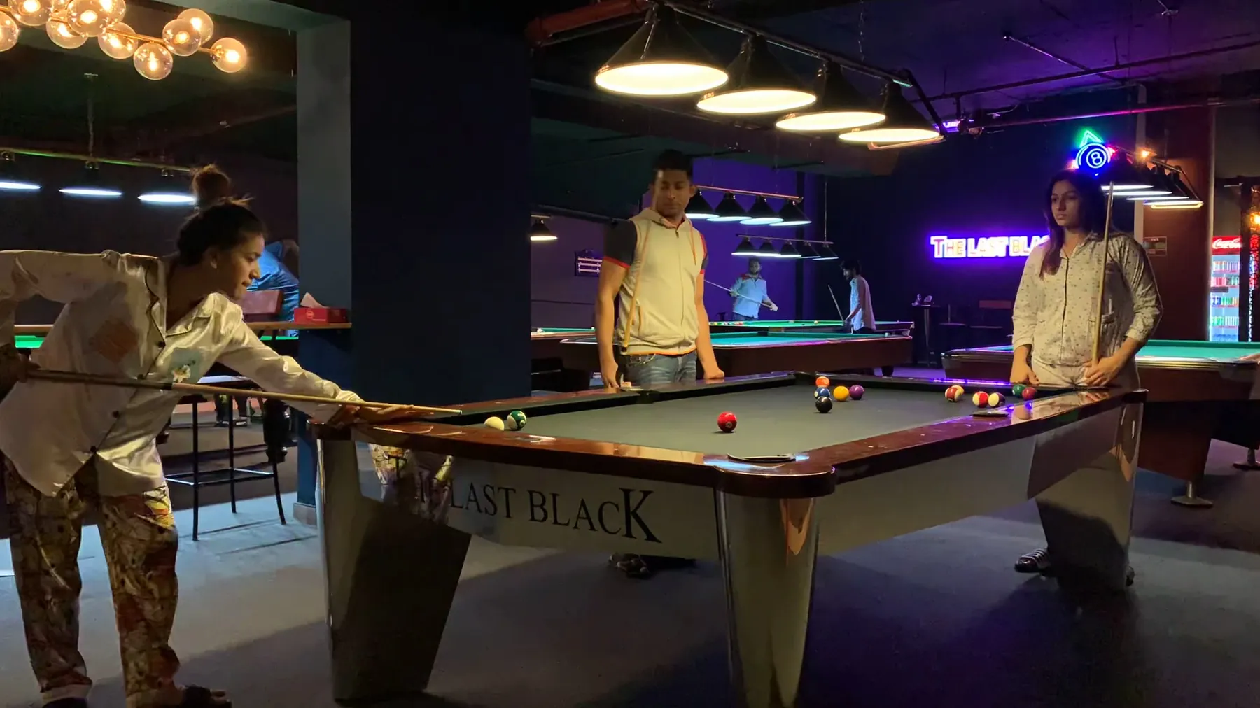 Rows of pool tables at The Last Black